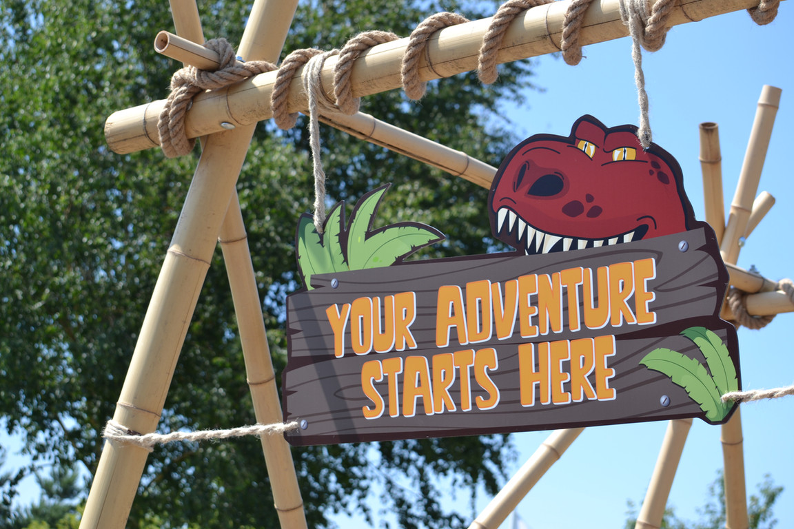 Adventure starts here sign