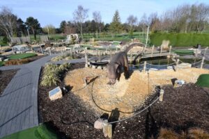 dinosaur at the centre of golf park