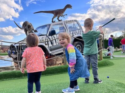 children playing in adventure golf park