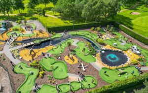 Aerial view of Wolverhampton Adventure Golf course showing putting greens, water features and dinosaur obstacles