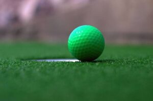 Golf ball on the green at the mini golf course in Perton